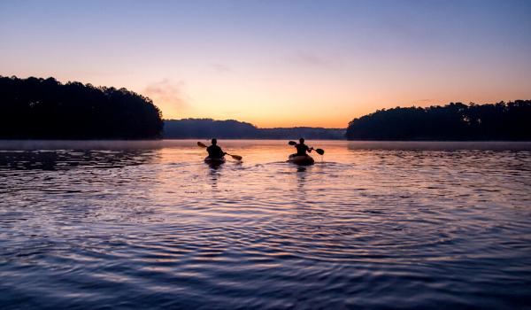couple paddle boarding on Lake Acworth